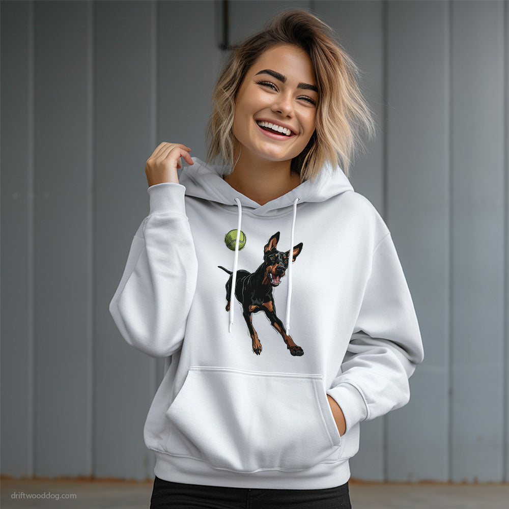 Dobermann Playing with a Tennis Ball Hoodie – Dog Graphic Hoodie for Women