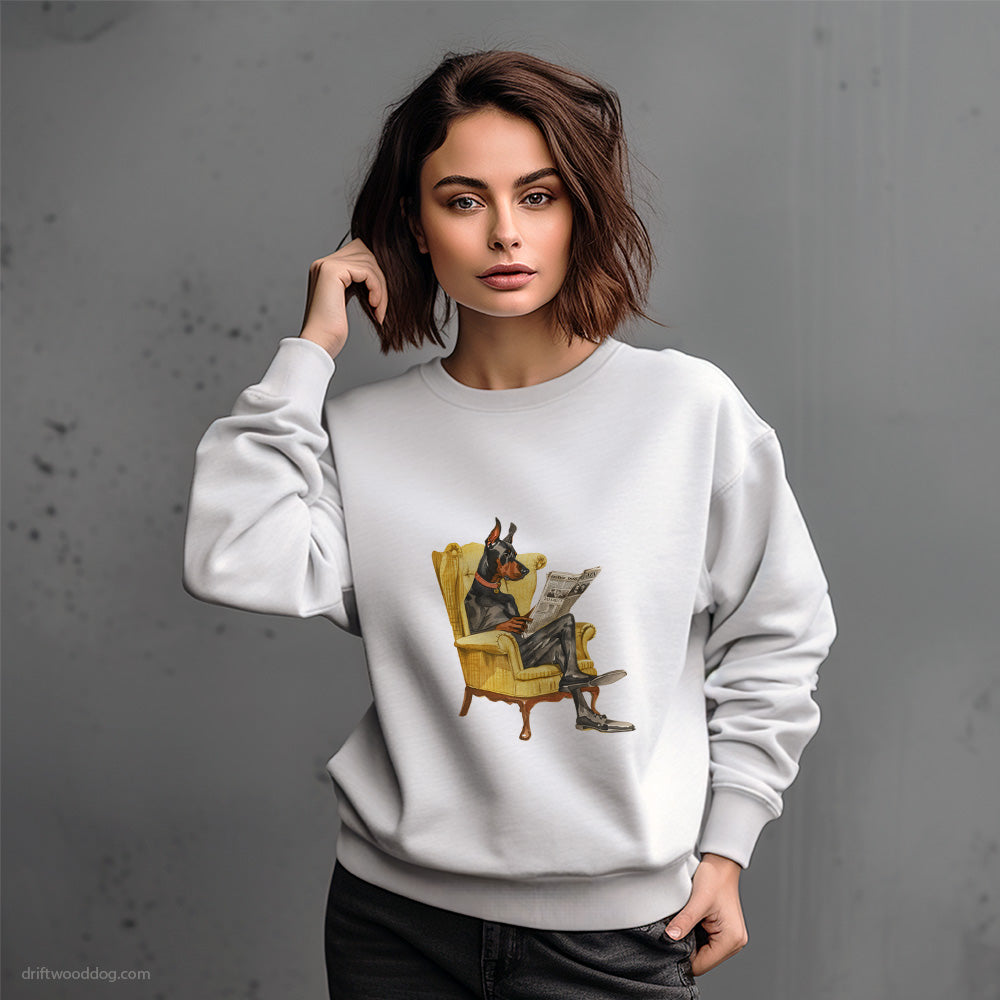 Dobermann Reading a Newspaper in a Chair Sweatshirt – Dog-Themed Gifts for Dog Lovers