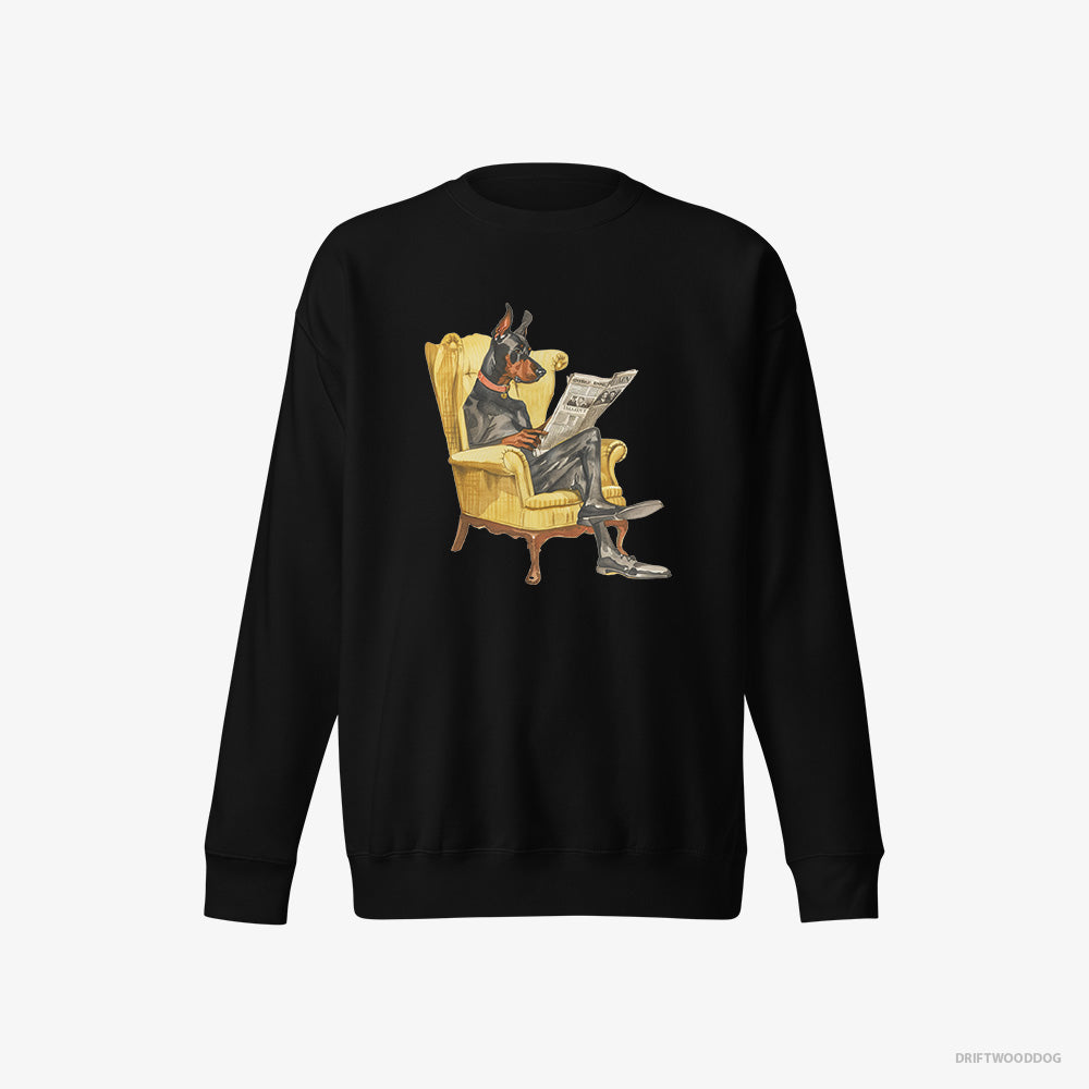 Dobermann Sweatshirt – Women Black Sweatshirt Eco-Friendly – Reading a Newspaper in a Chair (on White Background)