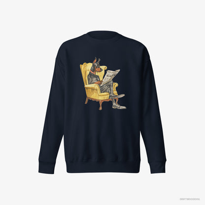 Dobermann Sweatshirt – Women Navy Sweatshirt Eco-Friendly – Reading a Newspaper in a Chair (on White Background)