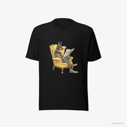 Dobermann Reading a Newspaper in a Chair Black T-Shirt