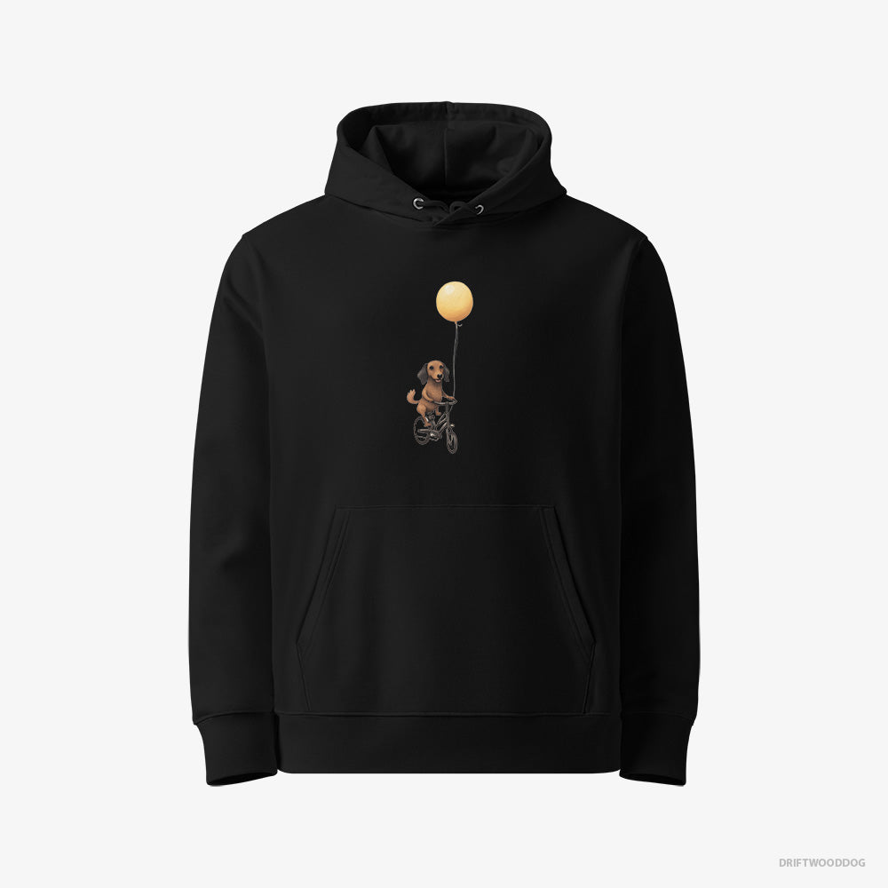 Dachshund Hoodie – Women Black Hoodie Eco-Friendly – Riding a Bicycle with a Balloon (on White Background)