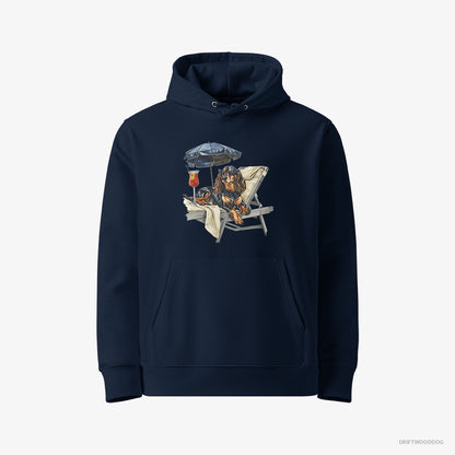 Dachshund Hoodie – Men Navy Hoodie Eco-Friendly – Relaxing on a Patio Lounger with a Cocktail (on White Background)