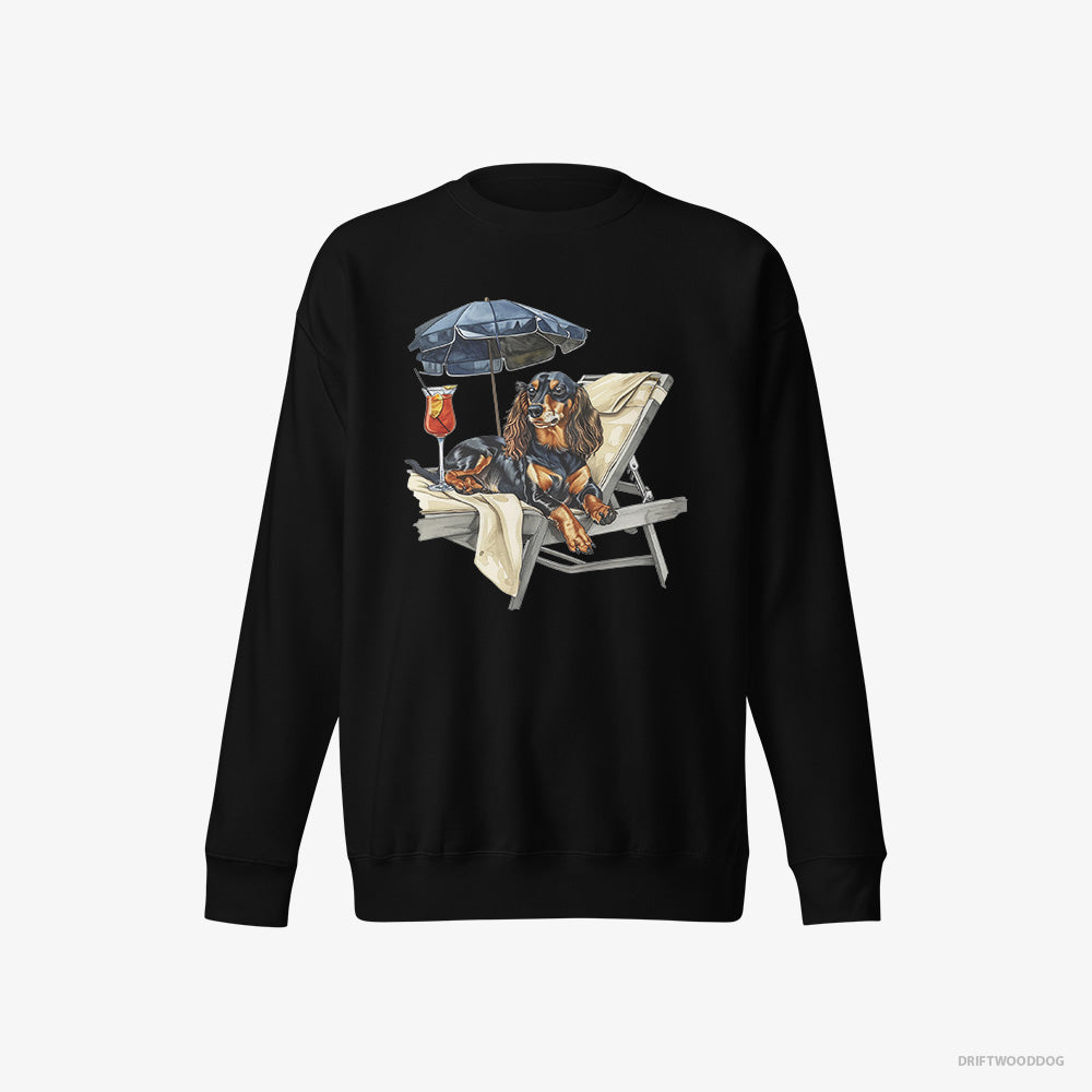 Dachshund Sweatshirt – Men Black Sweatshirt Eco-Friendly – Relaxing on a Patio Lounger with a Cocktail (on White Background)