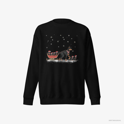 Dobermann Sweatshirt – Men Black Sweatshirt Eco-Friendly – Pulling Puppies on a Fun Sled Ride (on White Background)