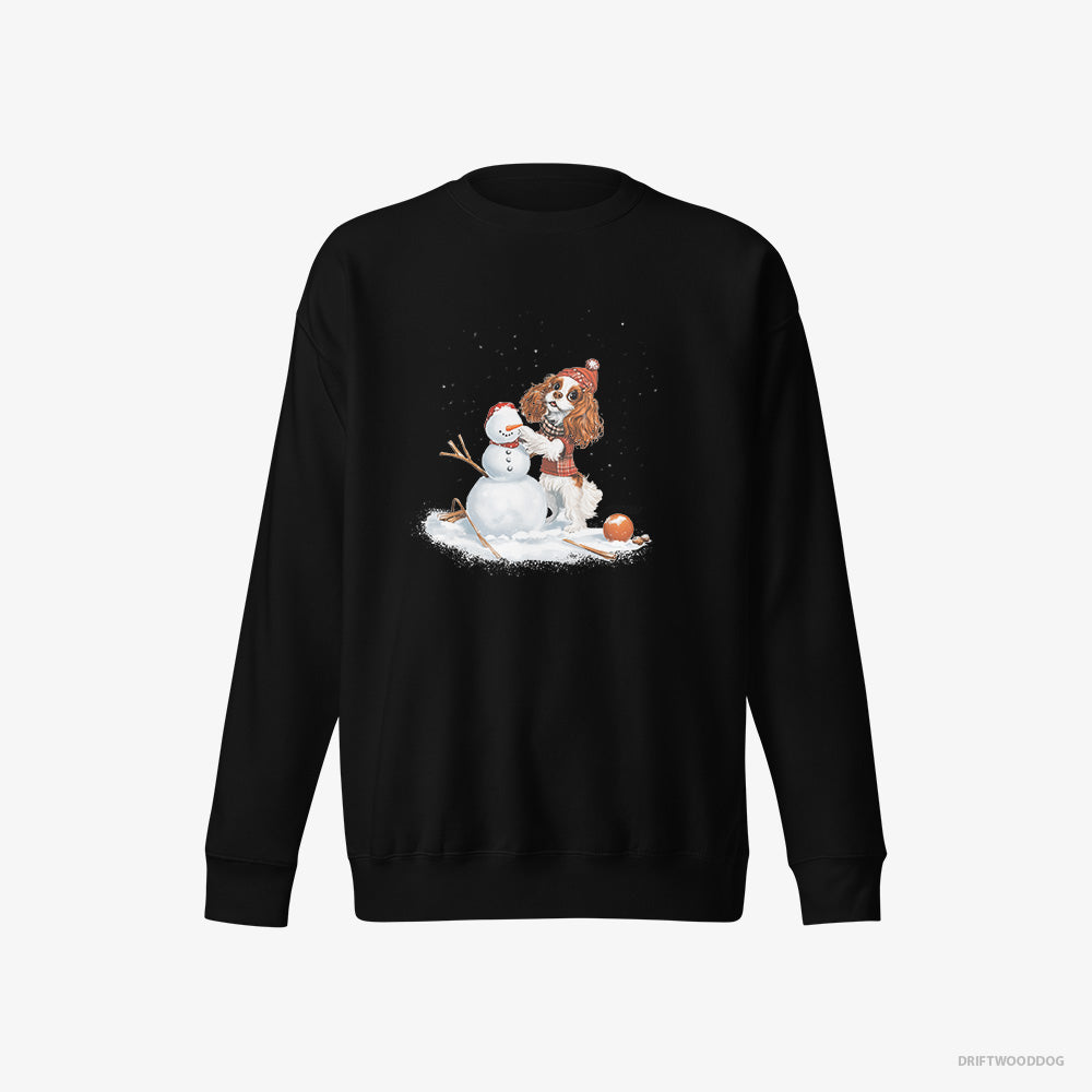 Cavalier King Charles Spaniel Sweatshirt – Men Black Sweatshirt Eco-Friendly – Crafting a Snowman (on White Background)