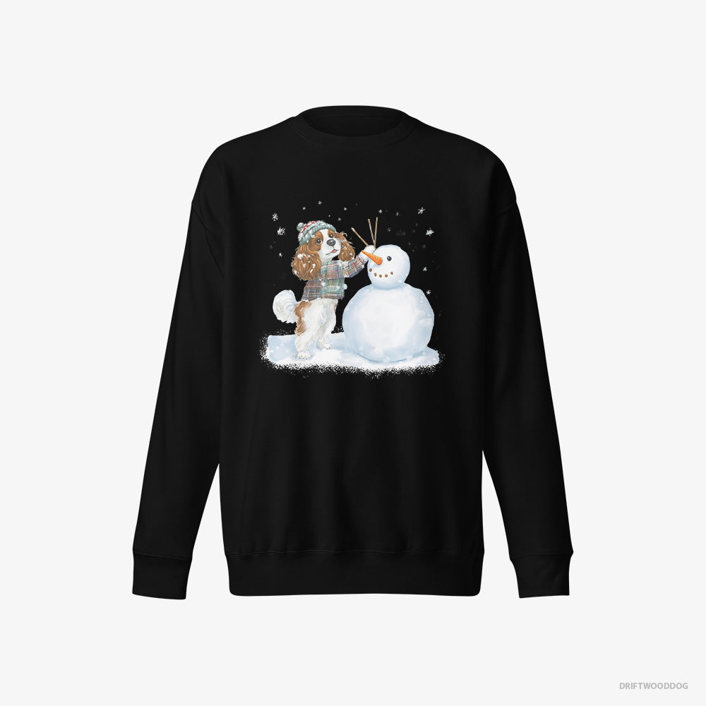 Cavalier King Charles Spaniel Sweatshirt – Women Black Sweatshirt Eco-Friendly – Sculpting a Snowman (on White Background)