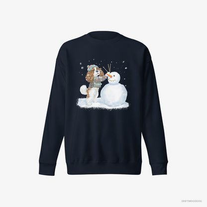 Cavalier King Charles Spaniel Sweatshirt – Men Navy Sweatshirt Eco-Friendly – Sculpting a Snowman (on White Background)