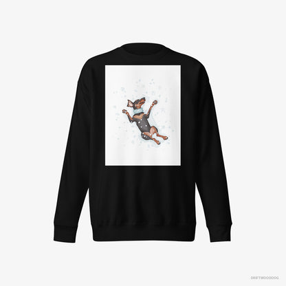 Dobermann Sweatshirt – Men Black Sweatshirt Eco-Friendly – Making a Snow Angel (on White Background)