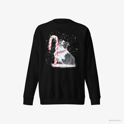 Border Collie Sweatshirt – Men Black Sweatshirt Eco-Friendly – by a Giant Christmas Lollipop (on White Background)