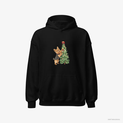 Yorkshire Terrier Putting Ornaments on the Christmas Tree Black Hoodie